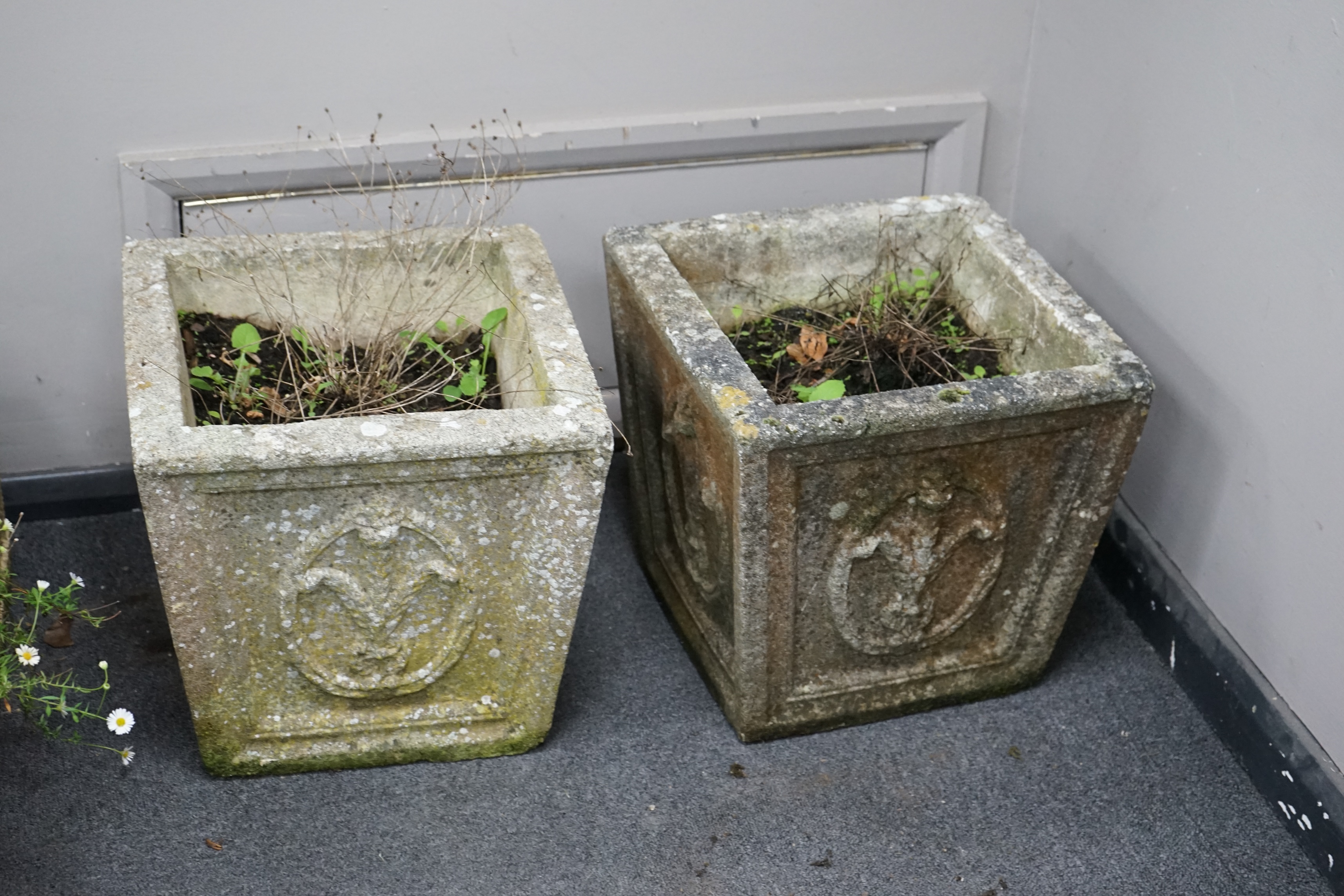 A pair of square tapered reconstituted stone garden planters